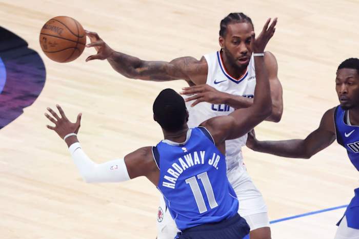 Jun 4, 2021; Dallas, Texas, USA; LA Clippers forward Kawhi Leonard (2) passes past Dallas Mavericks forward Tim Hardaway Jr. (11) during the third quarter during game six in the first round of the 2021 NBA Playoffs at American Airlines Center. Mandatory Credit: Kevin Jairaj-USA TODAY Sports